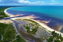 Aerial view of Corumbau beach, Caraíva, Bahia, Brazil. Great landscape. Beatiful beach with two colors of water. Beautiful beach scene. Vacation, travel, resort, peace, tranquility, paradisiac.