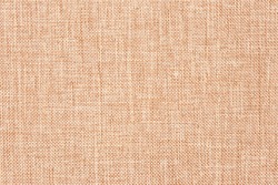 Canvas cloth, burlap, rustic home decor. Natural jute hessian, texture. Linen fabric pattern. Abstract light brown textile background. Woven wallpaper.