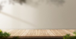 wood table background with sunlight window create leaf shadow on wall with blur indoor green plant foreground.panoramic banner mockup for display of product,warm tone lights