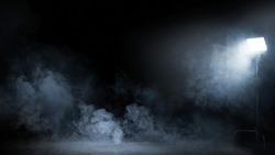 Conceptual image of a dark interior full of swirling fume