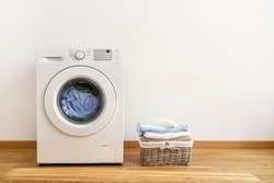 Washing machine, washing gel and laundry basket on white background