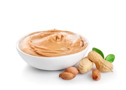 Creamy peanut butter in small bowl isolated on white background.