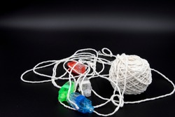 Ball of string with finger LED lights attached