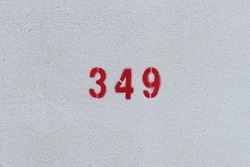 RED Number 349 on the white wall. Spray paint. 