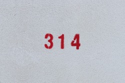 RED Number 314 on the white wall. Spray paint. 