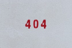 RED Number 404 on the white wall. Spray paint. 