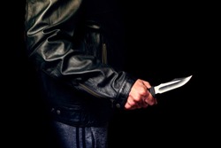 Teen threatened with a knife on the street, night lighting