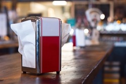 Old fashioned retro napkin dispencer in a diner restaurant