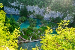 Aerial bird's eye view of “Plitvice” Lakes, waterfalls and bridge in HDR Croatia Europe National Park