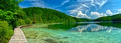 Extra wide panorama of “Plitvice” Lake, path and bridge in HDR Croatia Europe National Park