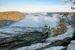 Rocks overlooking the misty Susquehanna river in the early autumn morning.
