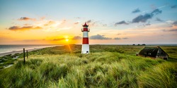 Sunrise at lighthouse in List on the island of Sylt, Schleswig-Holstein, Germany
