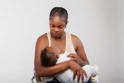 African black woman breast feeding her child.