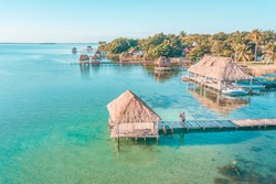 Aerial view of a Couple in Bacalar pier, Riviera Maya, Mexico