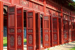 Amazing red wooden hallway in the Purple Forbidden City of the Imperial City within the Citadel in Hue, Vietnam. Hue is a popular tourist destination of Asia 