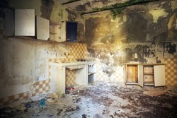 An interior shot of an old abandoned building's room with broken walls in Italy