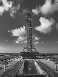 A grayscale vertical shot of a tall tower that will hold the SLS rocket in Kennedy Space Center