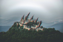 A wide shot of a turned trippy castle with on greenery with grey skies above