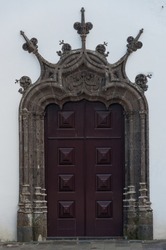 An ornately carved door and surround on a church in Ponta Delgada, Azores, Portugal