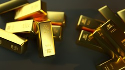A closeup shot of gold bullions on a black background - wealth business success concept