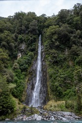 A beautiful view of the Thunder Creek Falls located in New Zealand