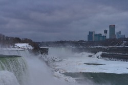 A breathtaking view of the famous Niagara Falls in Canada under a gloomy sky backgroundnd