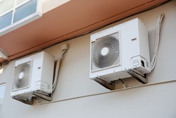 Outdoor Air conditioning units mounted on wall used for cooling spaces