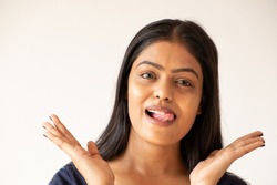 A closeup shot of a goofy Asian girl on a white background