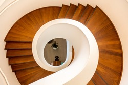 A top view of a wooden spiral staircase in a private house