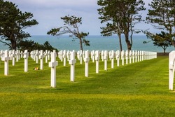 American cemetery on Omaha Beach, overlooking ocean and dramatic sky