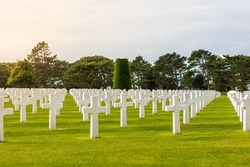 American cemetery at Omaha Beach, with blue summer sky and a warm sunshine