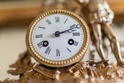 A selective focus shot of an antique-style clock