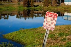 A closeup of a danger sign, do not feed