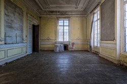 Room of an abandoned building with only a table and a chair  Chateau Cinderella