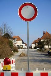 A road sign pole forbidding the prohibition on the street