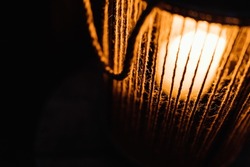 Soft and warm candle light glowing through strings