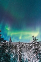 Green and purple northern lights in Rovaniemi Finnish Lapland