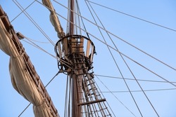 A old wooden sailing ship mast and sails, caravel, pirate ship