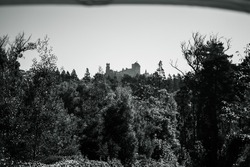 A grayscale low angle shot of Palace on the top of the hill in Sintra, Lisbon, Portugal