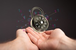A 3D rendered digital concept of security with floating padlock and binary code levitating above a person's hands