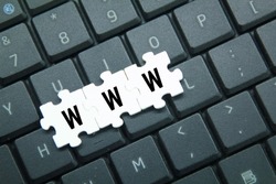 laptop keyboards and puzzles with the letters www  concept