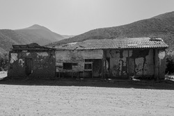 A grayscale of a century-old house in the municipality of Cabildo in Fissure, Chile