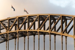 The Australian flags flying on the top of the Sydney Harbour Bridge