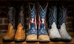 A closeup of Cowboy boots decorated with the American flag on sale in shops in downtown Nashville, Tennessee