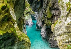 A breathtaking view of a turquoise stream in rocky Tolmin gorge in Slovenia