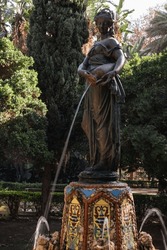 Discovering the beauty of La Nínfa del Cántaro (spanish for the Nymph of the Jug), a stunning bronze sculpture and fountain in the City Park of the Spanish city of Malaga