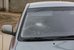 Broken car windshield. Damage to the glass. Accident of car. 