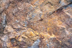 Rusted texture. Rusted background. Granite rocks. Colorful Rock background. Old Cracked Rusty Rough texture. Rock wall backdrop with rough red brown texture. Grunge Abstract Stone Surface. 