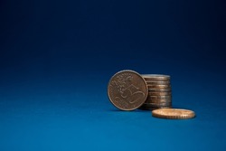 50 Euro cents on a blue background. A fifty cent coin stands beautiful wallpaper money (3)