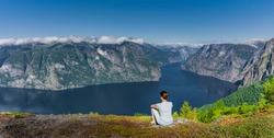 Woman by workout at Viewpoint of the Aurlandsfjord 